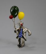 A white metal, enamel and glass set figure of a clown with balloons, 86mm.