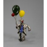 A white metal, enamel and glass set figure of a clown with balloons, 86mm.