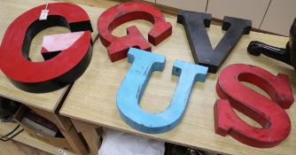 Five metal and composition signage letters - G (x2), U, S and V