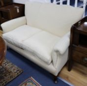 A small two-seat settee fitted loose cushions and raised on cabriole legs W.140cm