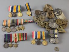 A collection of WWI to QEII miniature medals, spare ribbons and cap badges and buttons including a