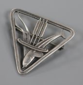 A Danish Georg Jensen sterling silver triangular dolphin and bulrushes brooch, no. 257, 37mm.