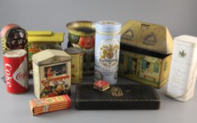 A group of 1920s and later novelty tins, including Lyons Tea money bank, Huntley & Palmer toby jug