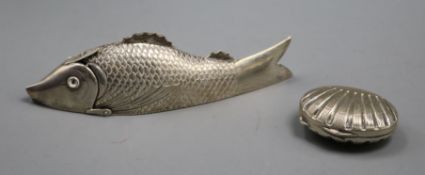 A Continental white metal articulated fish toothpick case and an Italian 800 shell pill box.