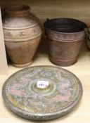An Indian copper bucket, a gong and terracotta pot