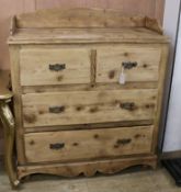 A pine chest of drawers with tray top W.109cm