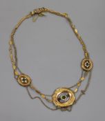 A 19th century French yellow metal, enamel and paste set double strand necklace, 42cm.