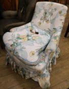 An early Victorian ladies' armchair raised on ebonised turned legs