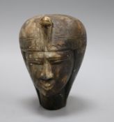 A stone carving of a head in Egyptian style