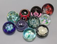 Ten paperweights including Caithness