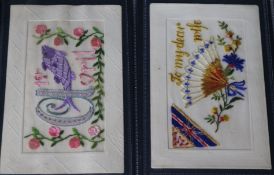 An album of WWI silks, machine woven postcards and comic postcards