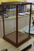 An oak-framed plate glass glazed display cabinet