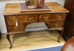 A Queen Anne style walnut writing table W.109cm