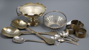 A small collection of silver items, including a circular pedestal bowl with glass liner and shaped