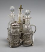 A Victorian five-bottle silver-mounted breakfast cruet, comprising cut glass pepper and salt (with