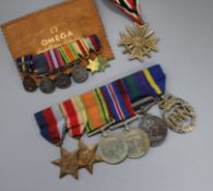 A German war medal, an English full set and miniature set of medals