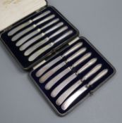 Two cased sets of six George V silver handled tea knives.
