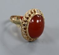 A 14k gold and cabochon carnelian oval dress ring, ring size O.