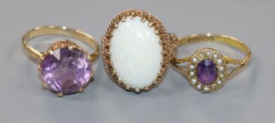 An Edwardian 9ct gold, amethyst and seed pearl set dress ring and two other later 9ct gold gem set