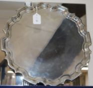 A large silver salver with piecrust edge, Walker & Hall, Sheffield (date mark rubbed), Dia 41.5cm