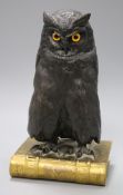 A bronze casket modelled as an owl standing with a book overall height 27.5cm