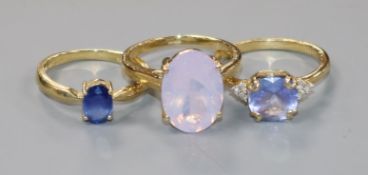 Three modern 10ct gold and gem set rings, gross 7.5 grams.