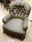A Victorian buttoned armchair