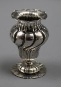 A continental 800 white metal wrythen fluted vase, 82mm.