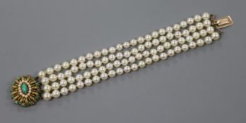 A four-strand cultured pearl bracelet with 9ct gold gem set clasp.