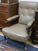 A Victorian oak reclining chair upholstered in pale green leather