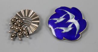 Two Scandinavian white metal brooches including enamelled decorated with birds, largest 5cm.