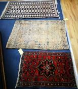 Two North West Persian rugs and a Bokhara rug 84 x 60cm, 120 x 86cm and 149 x 92cm