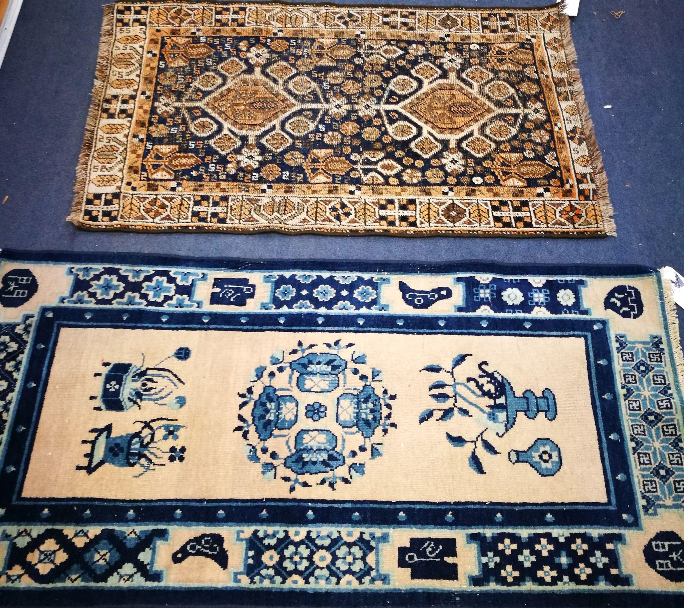 A North West Persian blue ground rug and a Chinese rug 120 x 77cm and 188 x 90cm
