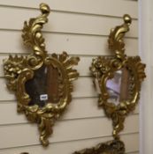 A pair of gilt carved wood cartouche shaped wall mirrors W.34cm