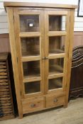 A modern oak display cabinet W.98cm