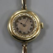 A lady's 1920's 18k gold and rose cut diamond set manual wind wrist watch.
