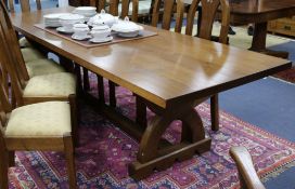An oak refectory table in the Gothic manner W.299cm