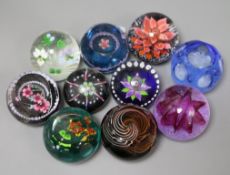 Ten paperweights including Caithness