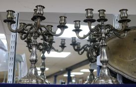 A pair of ornate Italian 800 white metal six light five branch candelabra, height 35cm, gross 78.5