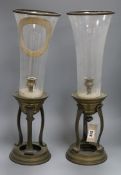 A pair of brass and glass storm lights height 55cm