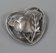 A Danish Georg Jensen sterling silver heart shaped brooch, modelled as a dove with olive branch, no.