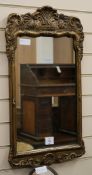 A George II style gilt wall mirror and a dressing table mirror W.40cm and 20cm