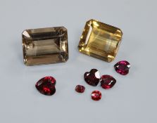 Two emerald cut unmounted stones, citrine & quartz and five heart shaped cut unmounted stones