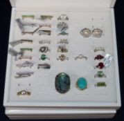 A quantity of assorted mainly silver dress rings in three boxes.