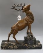 A Deco bronzed metal stag marked Omerth Length of base 44cm