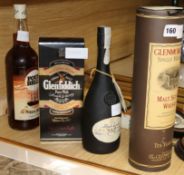 A bottle of Glenmorangie 10year old malt whisky, a bottle of Glenfiddich, a bottle of Six Bells, a