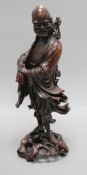 A late 19th/early 20th century Chinese hardwood figure of a luohan Height 43.5cm