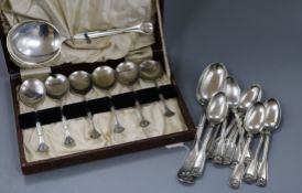 Eleven Tiffany & Co sterling silver fiddle and shell pattern teaspoons and a similar tablespoon