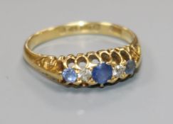 An early 20th century 18ct gold diamond and sapphire ring, size Q.