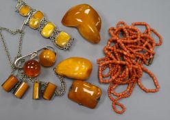 A white metal and amber bracelet, three amber brooches, two amber pendants, amber cufflinks and